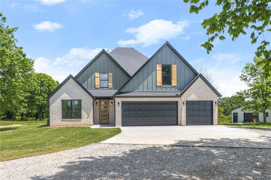 New construction home on 1.34AC, offering private setting w/out covenants. Builder upgrades throughout 4-bed home. 3 car garage & 900 SF shop - rare find just 15 minutes away from Downtown Bentonville and in Bentonville School District. Foyer entry w/guest bed & guest bath on left. Wood flooring throughout home. Spacious open living area has tons of natural light, overlooks private backyard w/wooded views & large open yard space. Living room boasts vaulted ceilings & gas FP. Kitchen features quartz countertops, large island, gas cooktop, great working layout & pantry. Dining space off kitchen. Primary suite w/private access to backyard & attached bath that connects to laundry. Primary bath has walk-in shower w/designer tile and built in shelving, soaking tub & dual vanity areas. The walk-in closet dual built in dressers. Large laundry has wash sink & built in storage bays. Upstairs is a large bonus room & 2 guest beds plus guest bath.