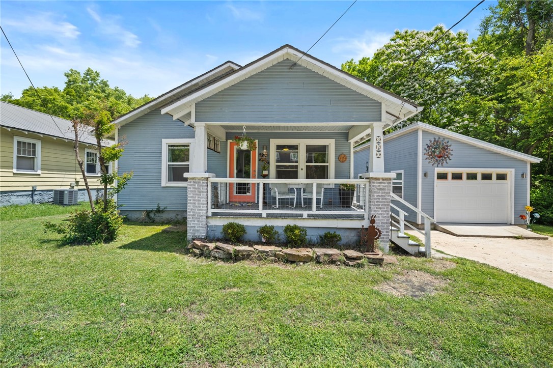 Welcome to this amazing Fayetteville retreat! Nestled just a short stroll from Historic Downtown this beautifully updated Craftsman-style home blends classic character w/ modern comfort. Featuring 2 Beds, 1 BA plus bonus room across 1056 square feet it’s an ideal find for first-time buyers, professionals, or savvy investors. Enjoy outdoor living in the heart of the city with a spacious, private backyard complete with a babbling brook, mature trees, fire pit and a new deck perfect for relaxing or entertaining. Major updates completed in 2018 ensure peace of mind and modern convenience throughout the home. Sitting on 0.19acres, this property includes a generous 14'x24' garage—great for storage, hobbies, or a workshop. With its unbeatable location near all things Fayetteville, including dining, trails, arts, and the University, you’ll love the lifestyle this home offers. Walk to Dickson St, Feed & Folly, Crisis Brewery, the Greenway more. Don’t miss your chance to own a piece of Fayetteville charm in a prime location!
