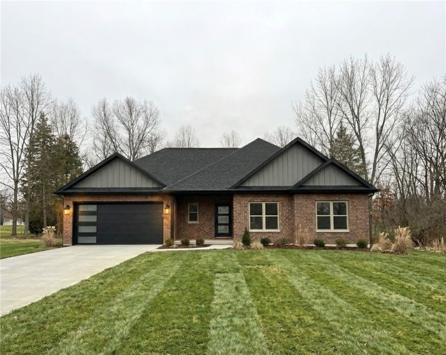 Welcome To Your Next Home At 17 Ironside Lane In Bella Vista! This Stunning New Construction "Miller" Plan Is A Home Run With Storage Galore And Space That Just Feels Good — Soaring Vaulted Ceilings With Dramatic Wood Beams, A Massive Open Living Space Anchored By An Electric Fireplace, And A Chef's Kitchen With, Custom Cabinets, Quartz Counters, Under Cab Lighting, Tile Backsplash, Walk-in Pantry. The Primary Suite Impresses With A Dual Vanity, Full Custom Tile Shower, And A Spacious Walk-In Closet. Enjoy A Dedicated Office, Second Bedroom, Laundry Room, Two-Car Garage, And A Covered Back Deck With Gorgeous Tree-Lined Views. This Home Is Just Getting Underway — Still Time To Make All Interior Selections And Make It Truly Yours! Deeded as a two-bed septic. 3rd Room To Be Considered An Office, Bonus Or Other Non-Sleeping Room. Signed Agreement Required. **Finished pics of previous build. This builds finish and design will vary.