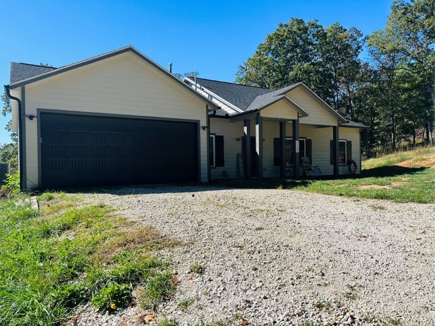 Located in lost Bridge Village minutes from Beaver Lake. This Home features three bedrooms plus and office with French doors and a deck off the office! Beautiful Kitchen with an island, open to the living room. It is a split floor plan with the master bedroom on one side and the guest rooms on the other side. Master bedroom is oversized with an oversize shower two sinks and a walk-in closet. This home sits on almost 2 acres of land. Ranch style home no stairs!!  Shows like a model home!