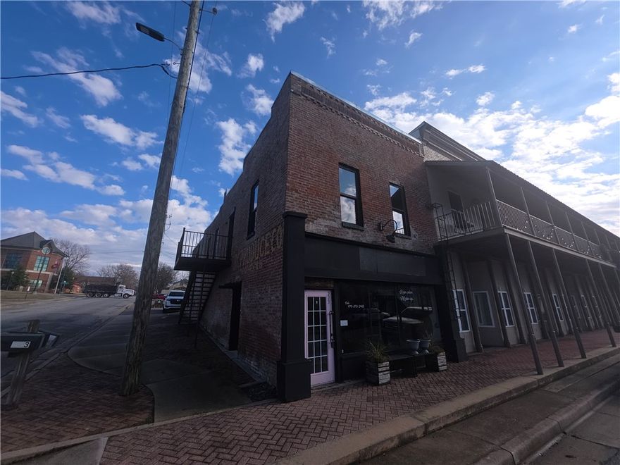 Great opportunity in downtown Siloam Springs.  Very unique brick building. This would be great for retail, restaurant, office, or even residential. There is access to the upstairs from outside as well as inside. It was previously a coffee shop.