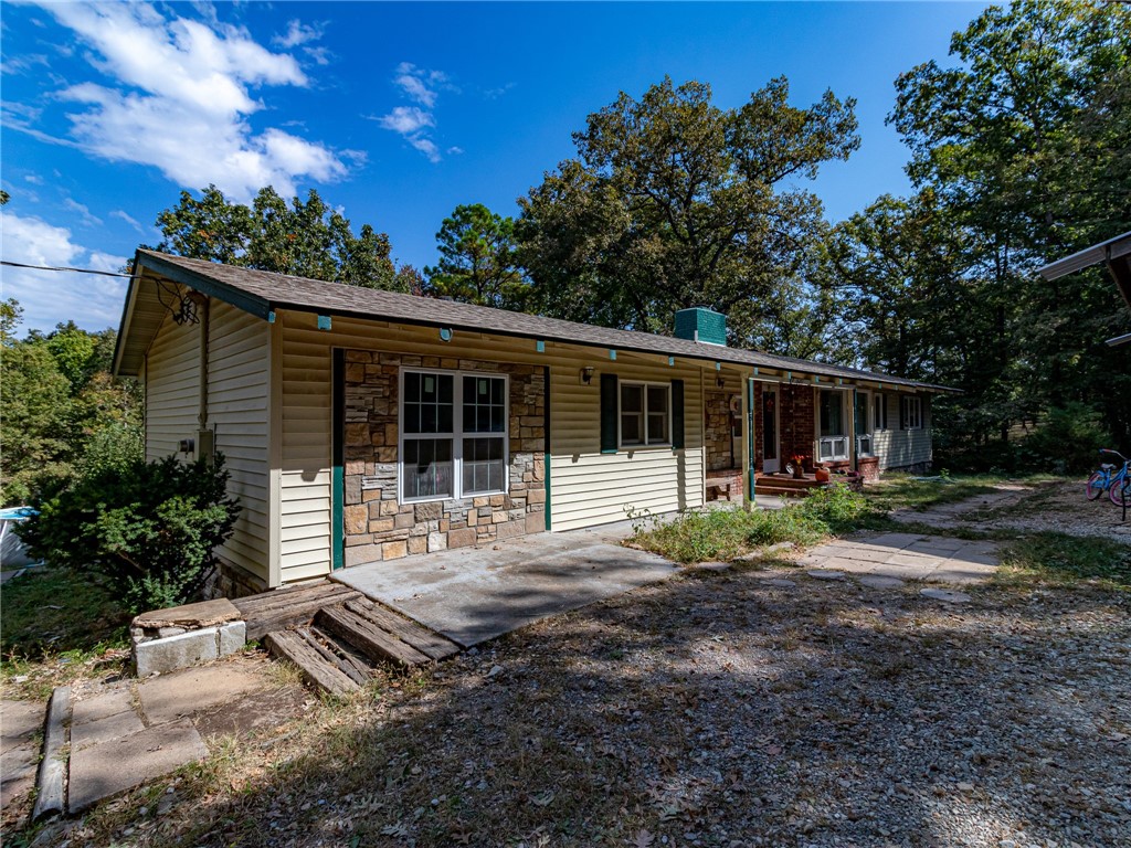 Bring the Kids, dogs, cats, chickens, and goats to this great home on 4.5 acres with a spring-fed pond . The 26 x36 Car Port /Pole barn could be enclosed for a great barn. Two tool sheds, 12x12 and 6x6. Small hay barn in the pasture. It also has a 1 car garage with a workshop. The whole property is fenced and crossed-fenced. There is a Storm shelter in the house rated for F-5 Storm and holds 10 adults.
The roof is 4 years old and has a new water heater. Above-ground pool 8 x 18 feet, Playground, jungle Jim all convey. The two Chicken coops and chicken runs also stay. Come see this secluded property just minutes from town. There is a Celler you access from the outside.