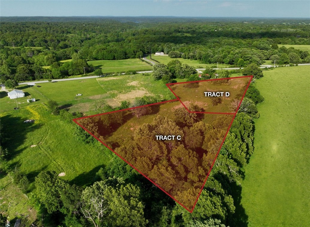 Endless possibilities! Check out this 2.57-acre ± lot in a fantastic location, just 10 minutes away from Springdale, 15 minutes from I-49, 9 minutes from a public ramp into Beaver Lake, and just 15 minutes from War Eagle Park & Marina. No deed restrictions, out of city limits! Electric and public water are available at the street.