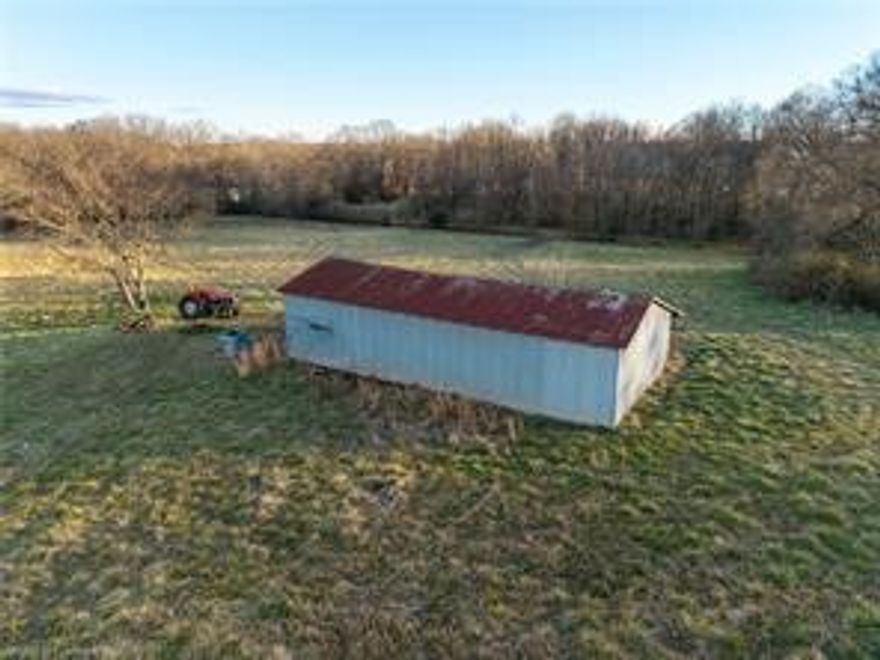 34.73 Acres in the Award-Winning Greenwood School District A rare opportunity to own 34.73 beautiful acres featuring a year-round creek, a mix of wooded and cleared land, fencing on two sides, and a barn for storage, livestock, or equipment. With road frontage and versatile terrain, this property is ideal for building, farming, recreation, or investment. Located in the highly sought-after Greenwood School District. Agent related to seller.