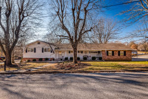 A rare find! Beautiful spacious home with a 42x40 Drive in Shop Building, all located here in town. This home offers over 3,100 sqft of open living space featuring 3 Bedrooms (4 Possible), 2 1/2 Baths, large open kitchen, wonderful sunroom, covered deck, fenced back yard, 2 car attached garage, gas log fireplace, kitchenette in basement, lots of storage. Many recent updates and move in ready. Shop building has two overhead doors and is heated. There is also an office that is heated and cooled along with a half bath. A very unique property,