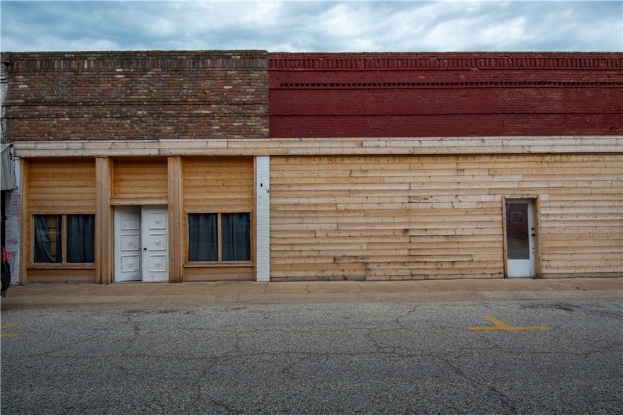 Prime commercial opportunity on the Berryville Square! This versatile property features three commercial suites that have been thoughtfully combined into one expansive space, offering endless possibilities for retail, office, warehouse, showroom, or mixed-use operations. Extensive updates provide peace of mind, including all new electrical, plumbing, and HVAC systems making the entire property heated and cooled. New Commercial size garage doors installed with one in the front and the other in the rear with a loading dock. The roof was recoated two years ago, helping minimize future maintenance costs. With flexible space, major system upgrades already completed, and a highly adaptable layout, this property is ready for your business or investment vision to come to life. All three properties are to be sold together but it wouldn't take much if someone wanted to convert them back into individual spaces.