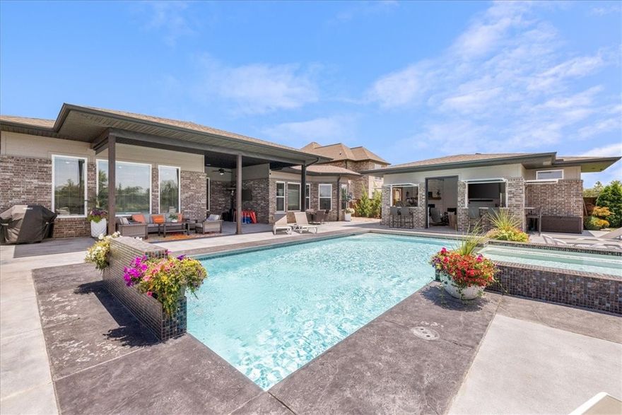 Experience resort-style living every day in this stunning custom-built retreat. The primary residence offers 2,947 sqft of beautifully designed space, featuring 4 bedrooms, 3 full baths, and two half baths. The 4th bedroom can be used as a flex space. Top of the line finishes and fixtures with a full built-in speaker system. The kitchen is a showstopper with a huge island & prep sink, double ovens, and loads of space for gathering.
Step outside to your private paradise: custom-built by OAK.  A luxurious heated saltwater pool with cascading waterfalls, an integrated hot tub, and a heated and cooled 400 sqft pool house with the 2nd half bath, perfect for entertaining and relaxing in style.
Located in a premier community with exceptional amenities, including a state-of-the-art clubhouse with a full kitchen for hosting events, a meeting room, a modern exercise facility, adult and kid pools, a playground, and a cozy fire pit area.  This property isn’t just a home, it’s a lifestyle.