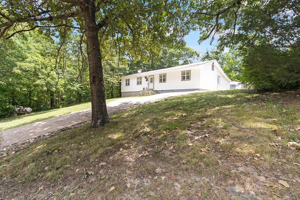 Adorable home in Winslow! This 4 bedroom, 1.5 bathroom home has charming qualities throughout including open living area creating functional space for everyone. Eat-in kitchen provides tiled backsplash, wrap around counter with multiple bar seating areas and plenty of cabinets and counter space. Spacious bedrooms. Enjoy the large mature trees surrounding the property. Great location that is moments from US-71 and only 15 minutes to Fort Smith Lake. Outbuilding gives excellent room for storage. Come check out this cutie today!