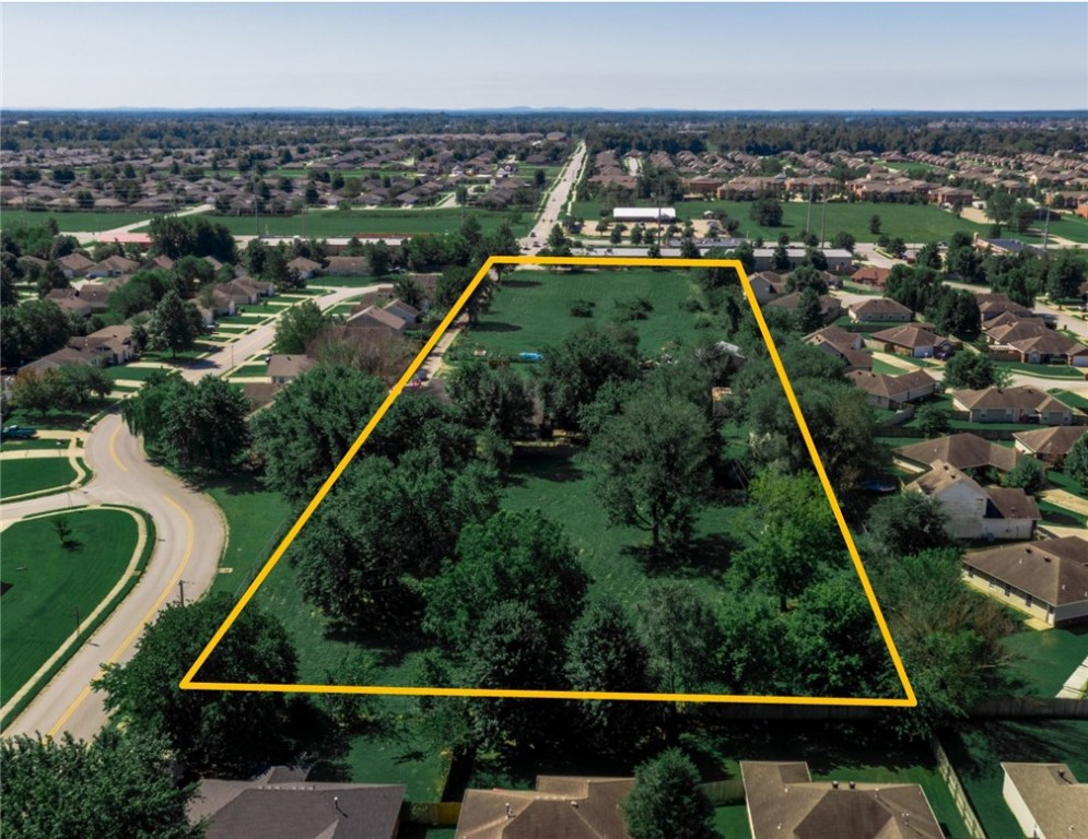 With 5.31 of flat use able land, two access points to Tunbridge Dr, all utilities-this land has great possibilities of uses. This tract of land has extremely high development potential. Open and level, ready for what you have in mind. Property is behind Beef O' Brady's. Currently zoned Agri. Home and shop buildings are "as-is". Price is reflecting land value. Land dimensions are 230'x1050'. Sewer tap is in the back and the main sewer line in at the front of the property.