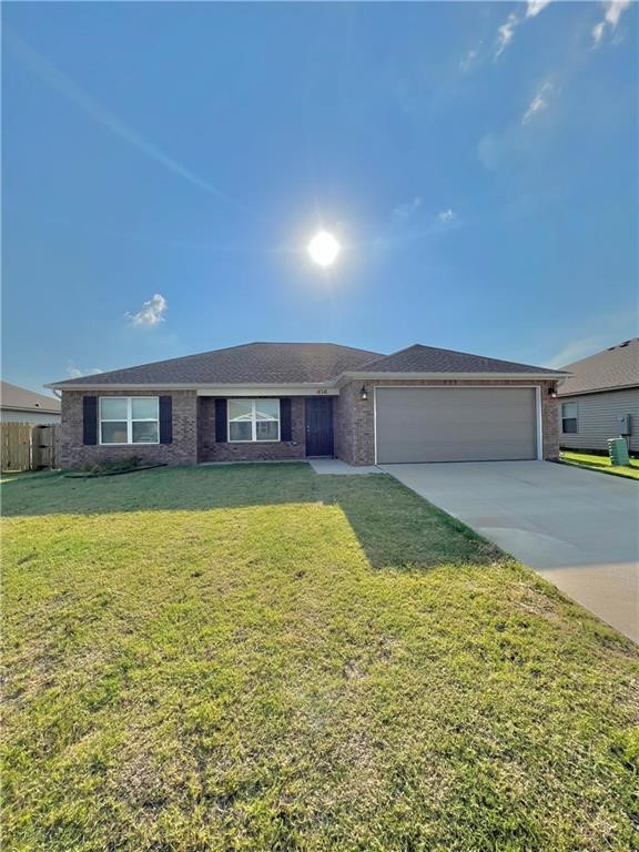 Spacious 3 bed 2 bath newer construction home in Lowell just a few short minutes from I-49 in the heart of NWA giving you easy access to places like JB Hunt, Walmart HQ, Tyson HQ, XNA and the UofA . This open floor plan features luxurious vinyl tile throughout the common areas and in the kitchen enjoy granite counters and Stainless Steel appliances including the fridge overlooking a vaulted ceiling living room. This home also features a large master bedroom with luxurious vinyl tile and in the master bathroom you will find plenty of storage and counter top space with dual sinks and a huge tiled shower. Also in this split floor plan you will find two other spacious carpeted bedrooms with a nice sized bathroom. Washer and Dryer included in a designated laundry room.