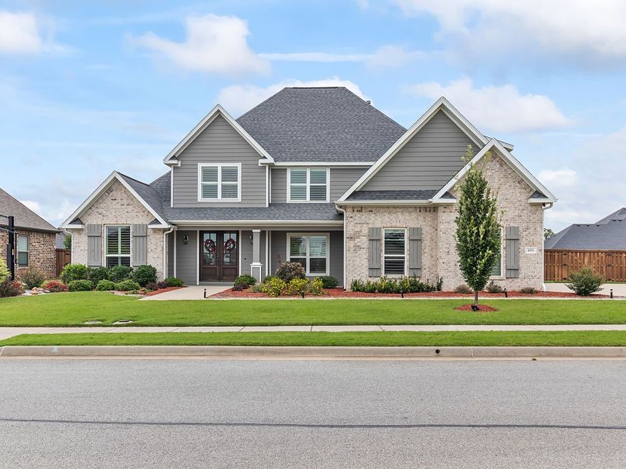 Immaculate home in the prestigious Scissortail Subdivision. Distinguished elegance pours through this pristine home with every detail and provides all the amenities one could dream of. Cathedral ceilings, quartz countertops, wood accent beams, gorgeous fixtures throughout and hand-scraped real wood flooring in main living areas. Chef's dream in gourmet kitchen equipped with center island, stainless steel appliances, double ovens, pot filler and walk-in pantry. Both formal and informal dining to handle all types of gatherings. Bonus room has media area and kitchenette with game area. Master suite located on main floor provides a personal retreat with massive walk-in closet, dual sink vanity, soaker tub, tiled shower and separate patio entrance. Entertainers dream with your very own paradise with private pool and waterfall feature, firepit area, covered patio and built-in grill. Prime location that is only 10 minutes away from XNA and Pinnacle Country Club. This one literally has it all!