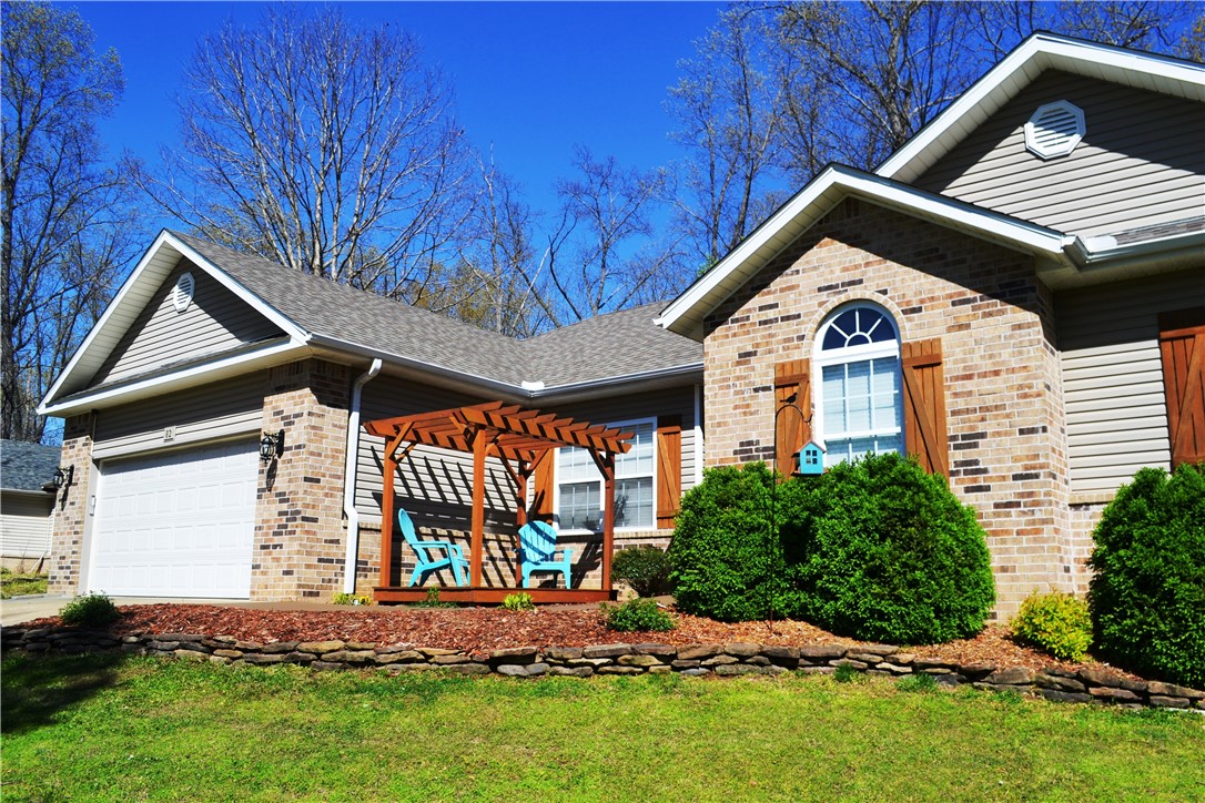 Fantastic house close to bike trails. This 3 bedroom 2 bath homes is convenient to everything Bella Vista has to offer. Back Forty trailhead and Metfield Clubhouse are just minutes away from this well maintained home. A screened back porch and adjacent hot tub on the deck creates an oasis to relax after outdoor activities are a long day at work. A gas fireplace in the living area gives a homey feel on a cold day. The large eat-in kitchen provides ample cabinet space with room to entertain. All kitchen appliances convey as well as the washer and dryer and an alarm system. Come check out this home and make it yours today.