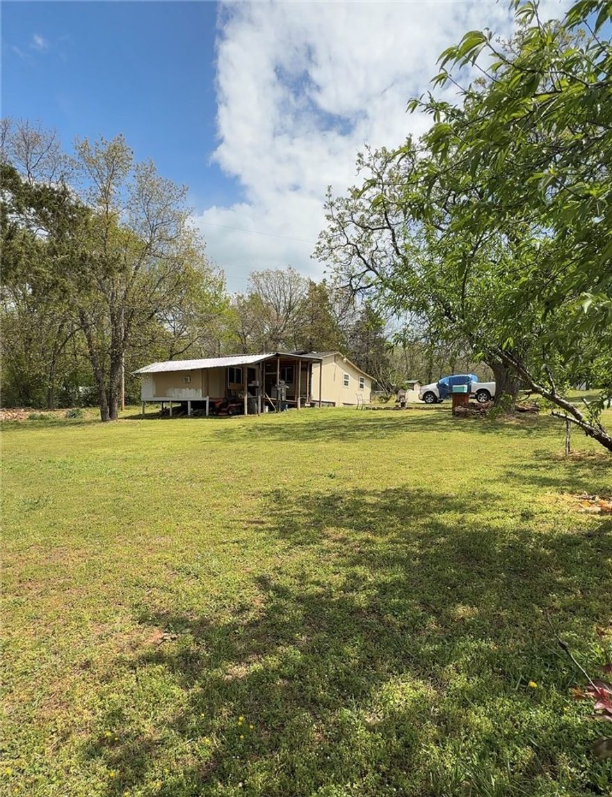 Country living close to town! 1.40 acres, RD eligible, outside city limits. Bring your horses, chickens, and cows.Enjoy peaceful living on 1.40 acres just outside Fayetteville city limits. This property features a 2-bedroom, 1-bath home with a bonus room and plenty of space for animals. Major updates include HVAC (2022), roof (2018), water heater replaced Feb 2025, and recently serviced septic. Conveniently located minutes from I-49, the University of Arkansas, and downtown Fayetteville.