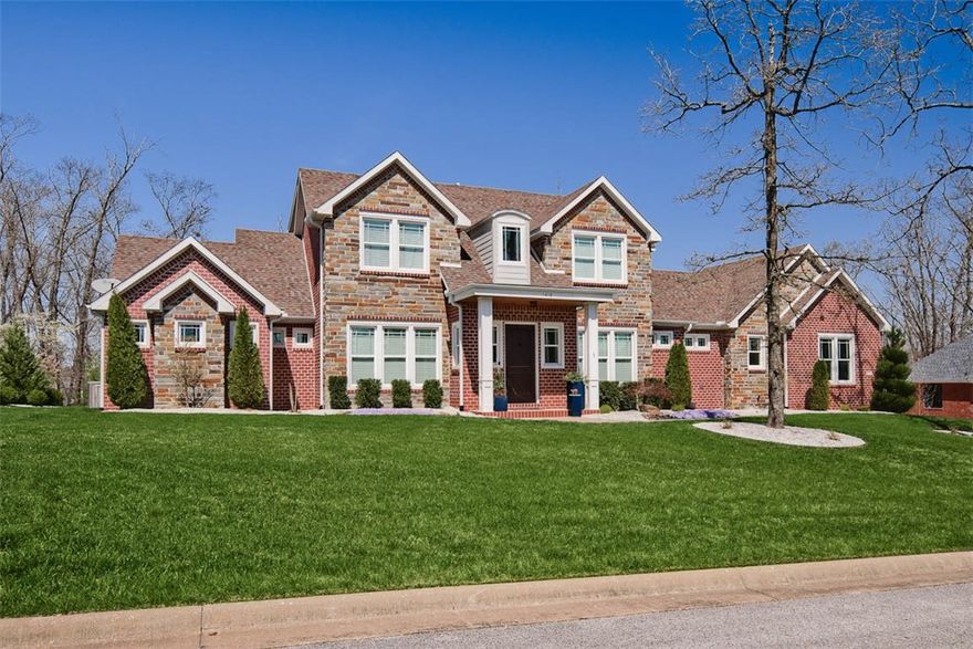 Built by Homes of Distinction; custom designed for a functional oasis. 5 Bed 4 Bath (2BD's on main level) 1.5 acres in the desirable Versailles neighborhood. True open floor plan that provides clear views of the custom pool & peaceful wooded lot. Great room features a high coffered ceiling. Gourmet kitchen includes floor to ceiling cabinets, an oversized island & combined dining. Walls of windows to enjoy views of nature, pool, & outdoor living space. Primary bedroom features a stacked stone fireplace, stacked stone shower wall, double walk-through shower, & an oversized soaking tub. Front office with glass pocket doors & lots of natural light. Large game room and additional attic storage. Registered in-ground storm shelter. Outdoor living includes screened-in deck, large stone patio, composite deck with pergola, and pool deck. Pool features include salt water, tanning ledge with bubbler, large tile wall with sheer waterfall, neon lights with pre-programmed light shows, in-ground umbrella, & pool sports slots.