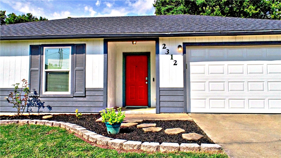 Super cute and close to everything Rogers including: schools, shopping, trails, restaurants and I-49. Home was completely remodeled in 2022 with new paint on interior and exterior, soft close kitchen cabinetry and hardware added, new granite countertops added, new luxury vinyl plank flooring added, subway tile backsplash added, granite kitchen sink added, new faucets, new windows, new interior doors, custom cedar barn door added to primary bedroom, walk in tile shower added, new granite in parimary bath, new fixures. Roof was replaced in 2020, hvac unit was replaced in 2019, shed is attached to the home and is 72sqft. Be sure to check out the big fenced yard and covered patio.