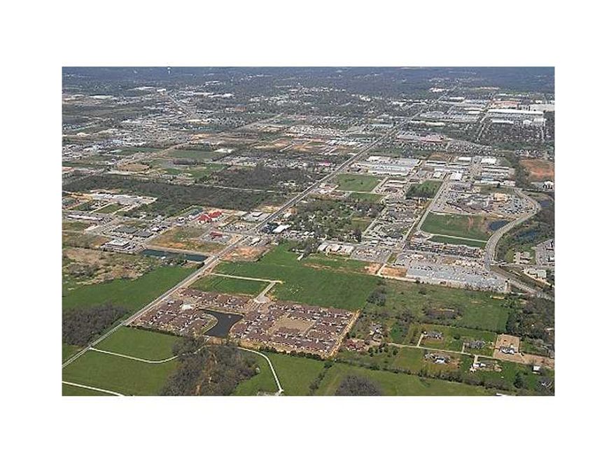 Beautiful Bronze entry way of cougar, bear and horse; ideal for medical/office development; streets,curbs, gutters -- all ready to build!  This is Lot 3; utilities available at all sites .   This parcel is priced at $5.25/sf