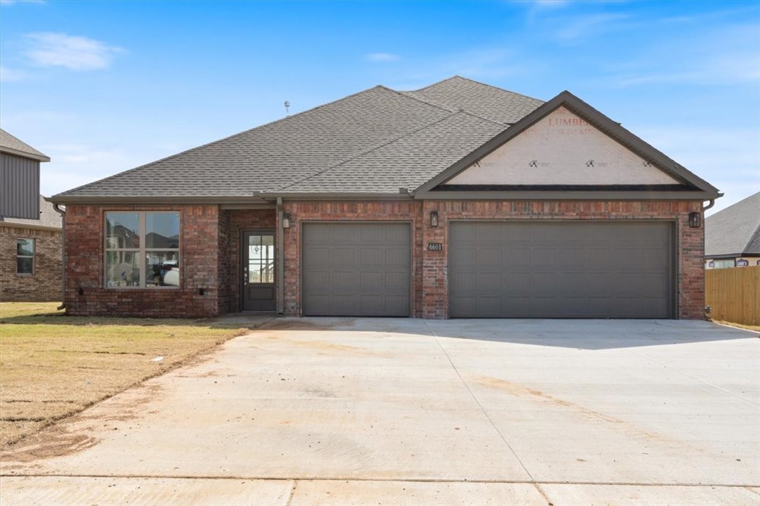 Welcome to 6601 Acacia St, a beautifully designed West-facing new construction home nestled in a brand-new Bentonville subdivision. This home is one of the few homes in the subdivision with a 3 car garage! This home offers the perfect blend of modern luxury & everyday functionality, all just minutes from Vaughn Elementary, XNA airport, grocery stores, gas stations, & more! The kitchen features quartz countertops, custom cabinetry with a built-in wine rack, & a large kitchen island. The living area boasts a cozy gas fireplace. The master suite is a true retreat, with a spa-like bathroom featuring a soaker tub built into the walk-in shower, creating a seamless & luxurious experience. Every detail in this home has been thoughtfully designed to create a comfortable, stylish living space. Fence, blinds, & gutters included!