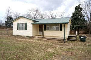 Convenient location near Interstate 40. 2 bedroom 1 bathroom home. Hardwood floors, lots of light and windows. Large lot with two outbuildings. 640 square feet.