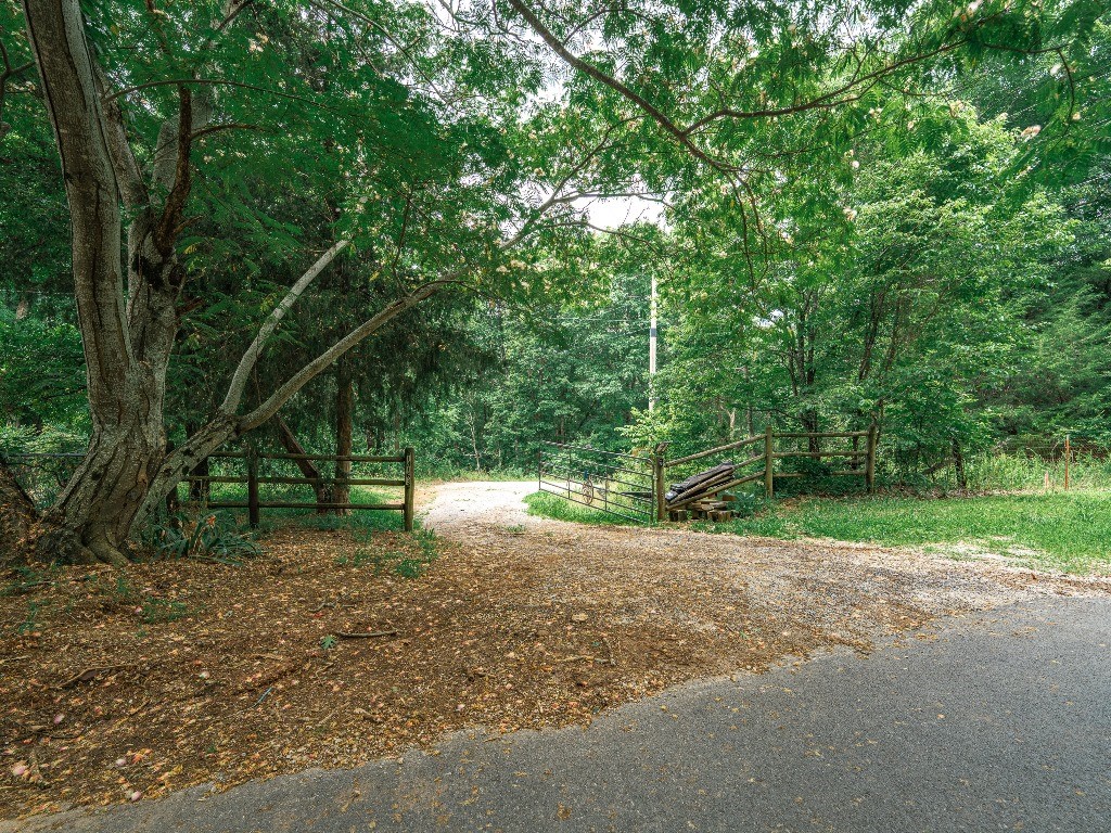 Cross through the gate off of paved Low Gap Road at 1850ā plus elevation and emerge into your wooded 8.44 acres while you enjoy the view along the scenic asphalt interior road. It is easy to explore along the power easement as you search for your favorite building site. Only 20 paved minutes to the University of Ar. at Fayetteville.