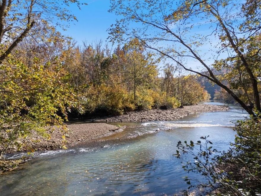 Exceptional Ozark retreat covering over 83 acres in the heart of the Little Mulberry Creek Valley, just 5 miles north of Hwy 215. This rare opportunity offers 2,500 ft of Little Mulberry Creek frontage and 1,700 ft of Friley Creek frontage, with their confluence only 130 yds from the cabin porch. Enjoy over 1 mile of established trails, mature timber and bottomland hardwoods. Excellent deer, turkey and bear hunting, with a strong age class in the local deer herd. Two newer cabins (1,120 sq ft & 1,914 sq ft) sit along Friley Creeks east bank, with another across the creek that is older but has a solid structure. A historic home from the settler days with a smokehouse adds to the beauty of this special property. Power, fiber and water on site with 4 total wells, creating the potential to expand with more waterfront cabins on numerous building sites. Adjoins Ozark National Forest to the South and West with little to no public access to the adjacent 450 acres. One of the most scenic and secluded valleys in the Ozarks.