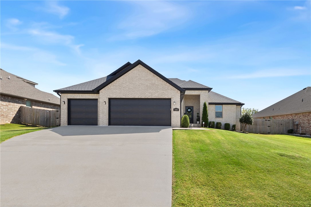 Welcome to this light-filled one-story home in Springdale! The open living room features a cozy gas fireplace and adjoining study. The eat-in kitchen offers granite counters, abundant cabinets, pantry, and views of the backyard and covered patio. Seller upgrades include hardwood floors in the office, hallway, and primary suite; extended concrete patio with screened-in porch frame, screens, recessed lighting, and outdoor fan; and updated light fixtures throughout. The spacious primary suite includes a large bath and walk-in closet. Additional highlights include wood floors in the living room, three-car garage with epoxy floor, window blinds, and a backyard storage shed for extra convenience. Located less than a mile from C.L. “Charlie” & Willie George Park with football, tennis, baseball, soccer, splash pad, walking trails, pavilions, and more!