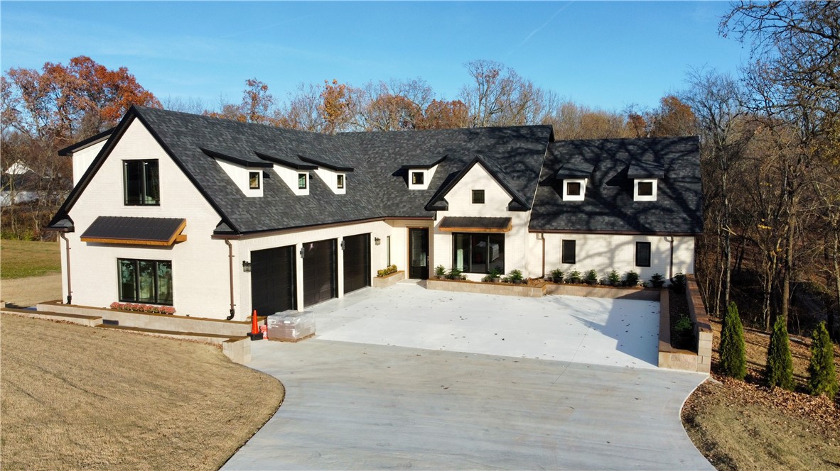 New Construction, modern farmhouse style home with a gorgeous exterior, in a desirable subdivision of Neveah Estates. Situated on a cul-de-sac, this home offers 3,611 sq ft of open concept living and a fabulous split floorplan w/2 en-suites all on .76-acre lot. The main floor is anchored by a beautiful gas fireplace and has 2 dining areas and a large living room that opens to the back deck, overlooking the private view and peaceful back yard setting. Enjoy entertaining guests in this gourmet kitchen complete with an oversized island topped with one-of-a kind Brazilian marble countertops. Additional features in the kitchen include pot filler, Dual ovens, Z-Line Gas Range, built-in microwave, wine fridge and pantry. Second floor hosts 2 bedrooms with 2 separate bathrooms on either side of a large bonus/media room. Home is wired with 22 speakers throughout the house including the oversized 3 car garage. Owner-Builder so property will be sold "AS IS" no additional updates completed by owner. To many amenities to list!