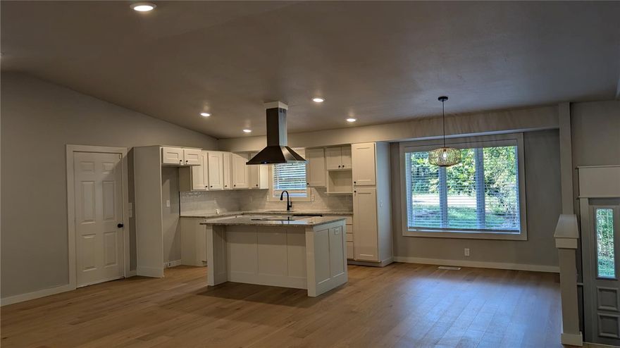 Experience the beauty and tranquility of Bella Vista in this charming single-family home located near Lake Ann. This inviting residence offers 3 bedrooms and 2 bathrooms with an open-concept living space filled with natural light. The modern kitchen features, ample cabinetry, and a breakfast bar perfect for casual dining. Enjoy peaceful mornings or evenings on the private deck overlooking wooded surroundings. Additional highlights include a spacious primary suite, in-unit washer and dryer hook-ups, and an attached two-car garage. Conveniently located near trails, golf courses, and lake access, this home provides the perfect balance of comfort and outdoor living.