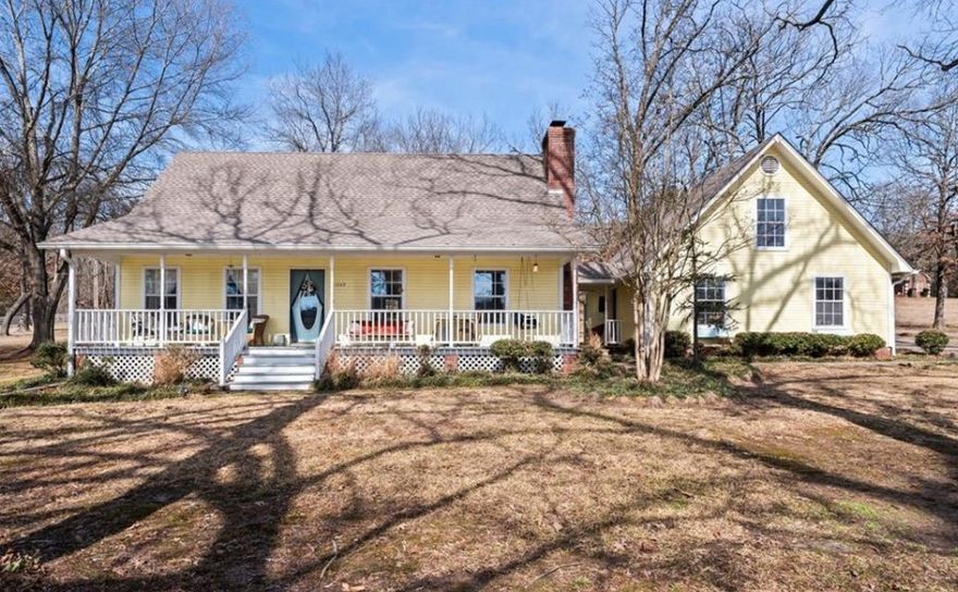 Welcome to this warm and inviting farmhouse cottage set on 1.64 acres in a scenic, peaceful neighborhood. With just over 2,400 heated sq ft, this 3-bedroom, 2.5-bath home offers a comfortable layout for everyday living and a quiet retreat. The primary suite on the main level provides convenience and privacy, while two additional bedrooms and a full bath upstairs offer flexible space for guests, family, or a home office. Plantation shutters throughout the main level add timeless character and enhance natural light. The kitchen features updated quartz countertops and a practical layout that flows into the main living spaces. Recent improvements include a new hot water heater (2023) and roof and gutters completed in 2021. Additional highlights include a 2-car garage connected by a breezeway and a 16x24 powered outbuilding, perfect for a workshop, storage, or hobby space. The back deck, built in 2023, is ideal for entertaining, relaxing, or enjoying the night sky in a peaceful, park-like setting.