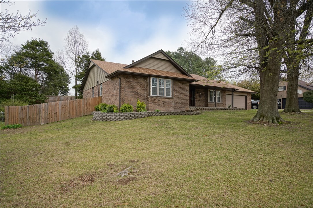 Home was completely remodeled two years ago. New light fixtures, double pane windows, cabinets, granite, bathroom vanities, toilets, showers, tub, laminate flooring, roof, garage door, doors throughout, plumbing fixtures, stone fireplace, etc. Recently, re-carpeted & re-painted. Home warranty offered. A must see to appreciate! Elmwood Elementary, Central Jr. High, Har-Ber High School. Listing agent related to seller.