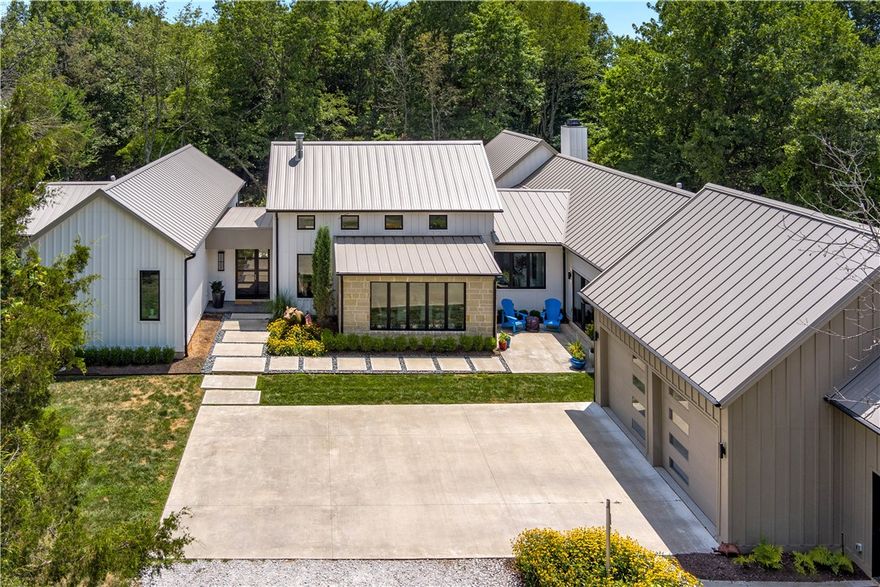 Unique custom Legend Builders Home sitting on over 2 secluded acres in the heart of town. Very open with 20 ft ceilings in main living area, quartz counters throughout the house. tons of glass, oversized screen porch overlooking a beautiful, heated pool. Private covered patio outside owner's suite, over 600 sq. ft of owner's closet space. The Owners bath has an oversized tiled shower with 2 shower heads and hand wand. 3rd bedroom or option room off media/family room. Beautiful entertaining kitchen area with extra room, wine fridge and extra cabinetry for storage plus spacious butler's closet and pantry.  Beautiful landscaping front and back make the setting so serene.  Too many custom features to list. This home is a must to see for any buyer who wants something special. All tile floors and a one level home are hard-to-find features. Extra owner's suite is perfect for guests or family members. This home is loaded with beautiful large wood encased windows.
Don't miss out on this fabulous home.