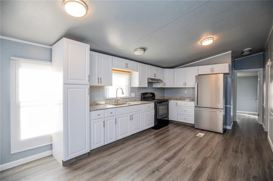Newly remodeled home in Gravette. 3 bedroom 2 bath home with country setting. Split floor plan. Wood
style flooring throughout. Kitchen features granite counters and includes refrigerator. Property sits on
about 1/4 of an acre. Tenant will be responsible for lawncare. No pets