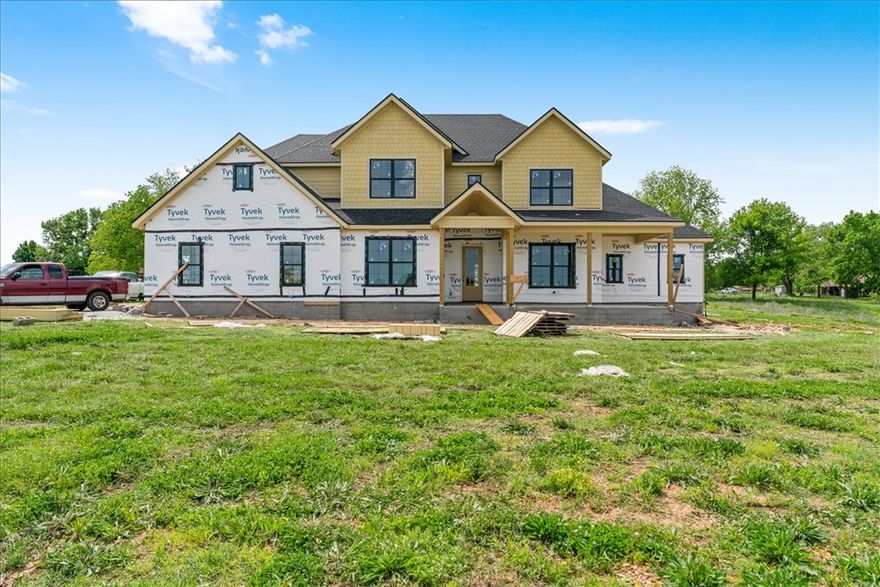 Look forward to coming home to Springdale newest Subdivision, Magnolia Meadows off Harmon Rd
Fayetteville Address, Springdale Schools, near Tontitown. One acre lots, 3 car garage, 3200 - 3800 sq ft
homes planned. Just getting started but this home has 4 bedrooms, 4 bathrooms, study and media room. Front porch, back deck and all the space you need. Sprinkler system in the sodded areas as well.  Come check it out.