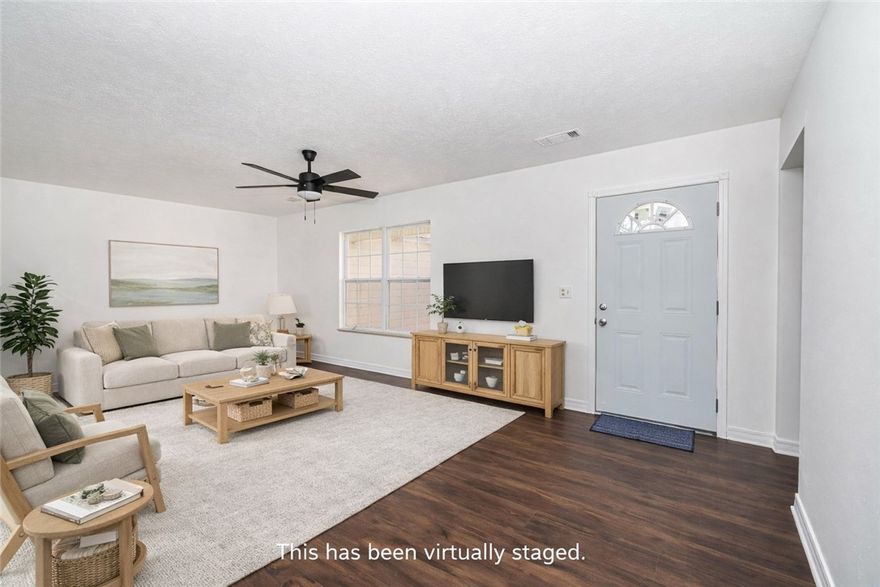 Spacious home situated on approximately 6 acres offering privacy, usable land, and recent updates throughout. Interior features include a living room and separate den providing flexible living and entertaining spaces. Recent improvements include new luxury vinyl plank flooring, fresh interior paint, select new doors and windows, new roof and updated appliances. Functional floor plan with multiple living areas allows space for gatherings, hobbies, or home office needs. The acreage offers room for outdoor enjoyment, recreation, gardening, or future improvements. Combination of land, updates, and versatile interior spaces creates an appealing opportunity for buyers seeking country living with modern updates. Convenient access to nearby amenities while maintaining a peaceful setting.