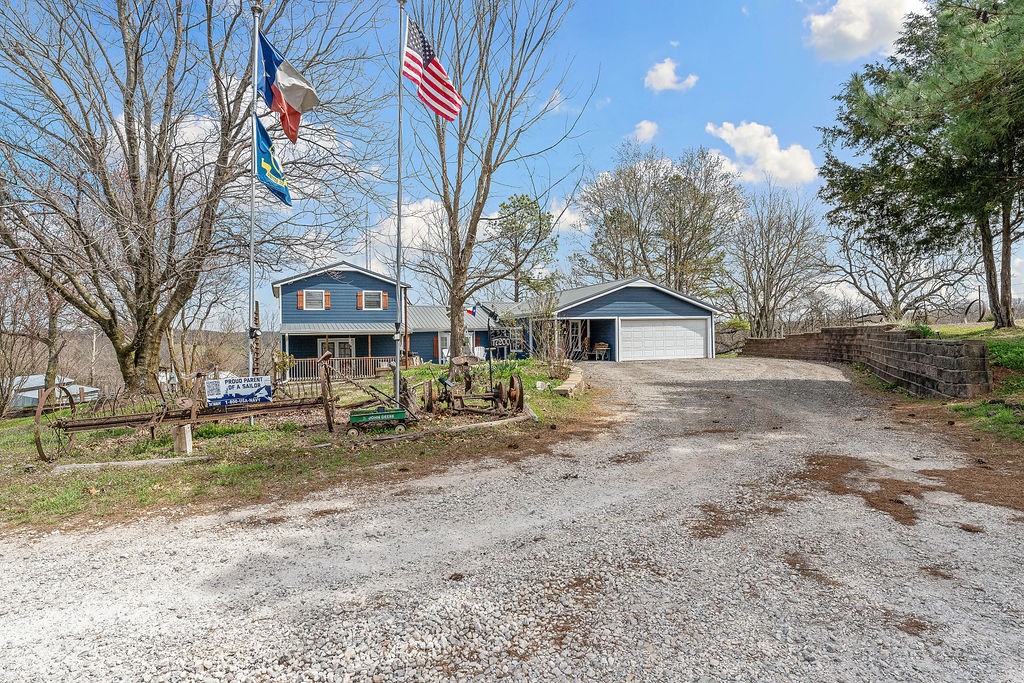 Country living just minutes from town. Spacious bedrooms with large closets. Open kitchen with bar and eat in area. Great for entertaining. Bonus room for a man cave or additional office/bedroom. Enjoy watching the wildlife under the covered patio. Large out buildings and over 5 fully fenced acres! Private with lots of mature trees! The main insulated shop has a pit in it for working on equipment or vehicles.