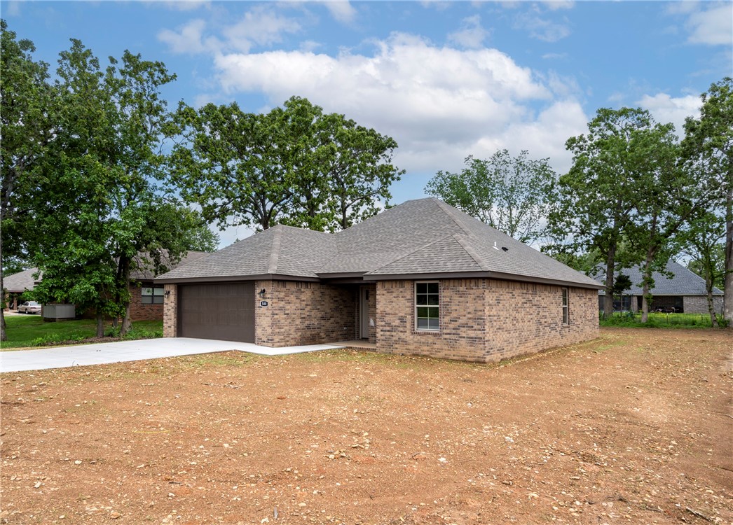 Gorgeous new construction home built by a custom home builder with an eye for detail! 1529 sq ft with 3 bedroom and 2 baths. Lots of extras including full brick, granite, fireplace, soft close cabinets, walk in closets, spacious covered patio, on a hard to find extra large lot. Builder to sod front and sides and seed backyard. Perfect open floor plan in this adorable small town. On the same street as the school! Don't miss this opportunity to own this new home!