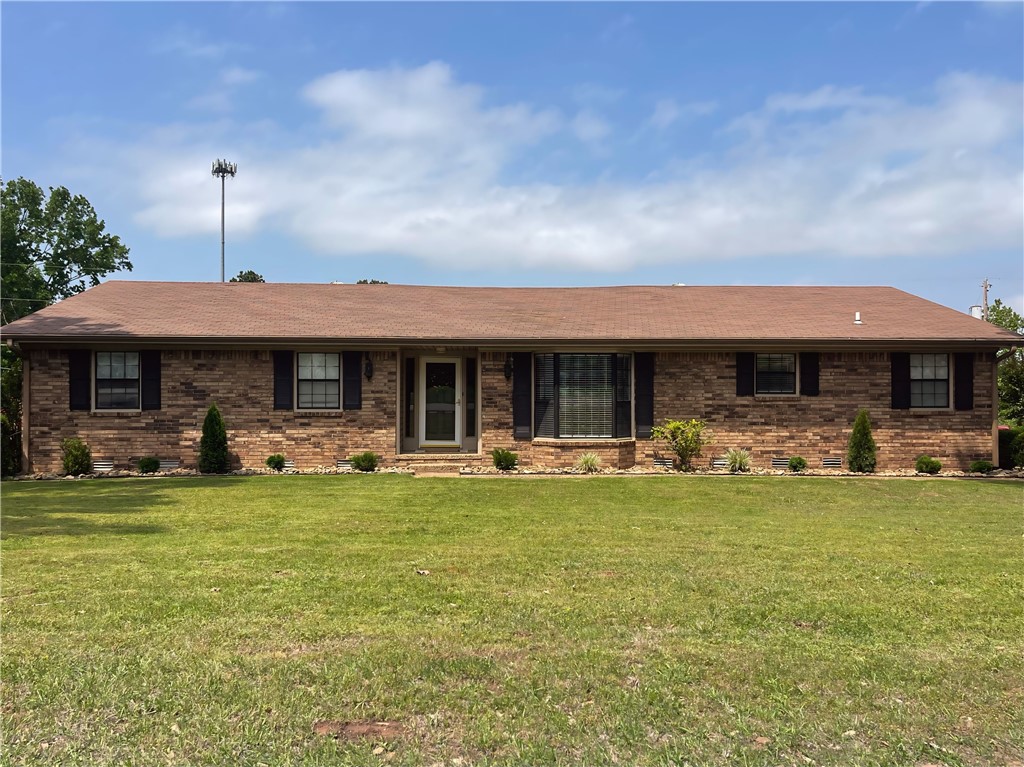 Gorgeous, updated 1716 sq foot home on over half an acre in a beautiful Barling neighborhood. Enter to a grand living area with cathederal ceilings and wood beams, new flooring, fresh paint, and an open concept for today's modern family. Clean white kitchen with stainless appliances and just off the kitchen you'll find a large laundry room and 3rd bathroom with loads of additional storage! Guest bath in hall boasts a double vanity, all new fixtures and a modern vibe! Large guest bedrooms with updated lighting, flooring and paint, make a comfortable place for friends and family to stay! Master suite features a large walk in closet, gorgeous tiled walk in shower, stunning vanity and all new fixtures! New HVAC unit and a fully encapsulated crawl space makes for affordable electric bills while protecting the integrity of the home. Huge fully fenced backyard for privacy and plenty of room for pets and children to roam. Large workshop/storage building out back, as well as a 2 car side entry garage.