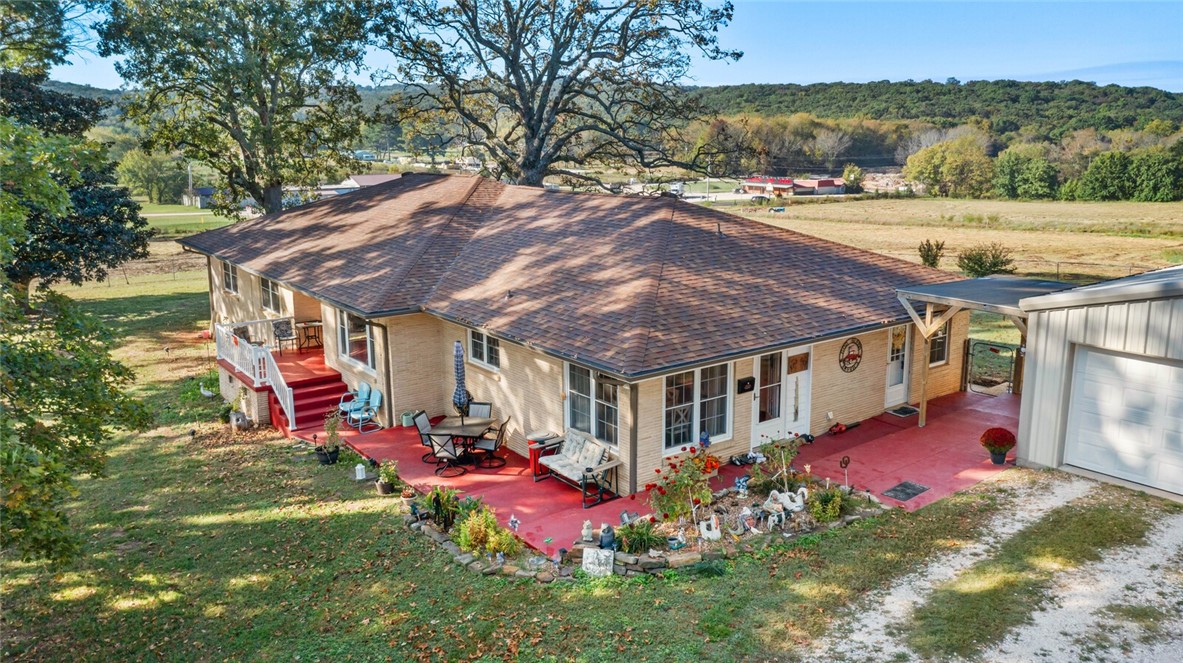 This spacious 2,577 sq ft home offers the perfect blend of comfort, functionality, and outdoor living. With 3 bedrooms and 2 bathrooms, this beautifully maintained property sits on 10 acres and includes a stocked pond (bass, catfish, and perch). Inside, you'll find an updated kitchen with granite countertops, eat-in breakfast area, and formal dining room. Hardwood/engineered hardwood floors and tile run throughout the home. A cedar-lined walk-in closet and a walk-in shower are located in the master bedroom, while the second bath features a convenient tub/shower combo.
Enjoy cozy evenings by the gas fireplace in the living room, and take advantage of abundant built-in storage throughout the home.
This property shines with three shops, one barn, and a shed-perfect for hobbies, storage, or small livestock.
Don't miss your chance to own this rare combination of updated living and country charm — all just a short drive from town!