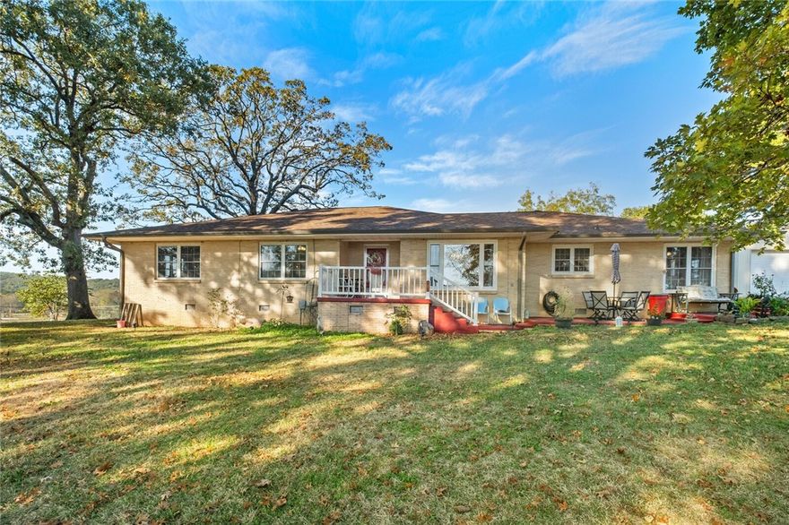 This spacious 2,577 sq ft home offers the perfect blend of comfort, functionality, and outdoor living. With 3 bedrooms and 2 bathrooms, this beautifully maintained property sits on 10 acres and includes a stocked pond (bass, catfish, and perch).  Inside, you'll find an updated kitchen with granite countertops, eat-in breakfast area, and formal dining room. Hardwood/engineered hardwood floors and tile run throughout the home.  A cedar-lined walk-in closet and a walk-in shower are located in the master bedroom, while the second bath features a convenient tub/shower combo.
Enjoy cozy evenings by the gas fireplace in the living room, and take advantage of abundant built-in storage throughout the home.
This property shines with three shops, one barn, and a shed-perfect for hobbies, storage, or small livestock.  
Don't miss your chance to own this rare combination of updated living and country charm — all just a short drive from town!