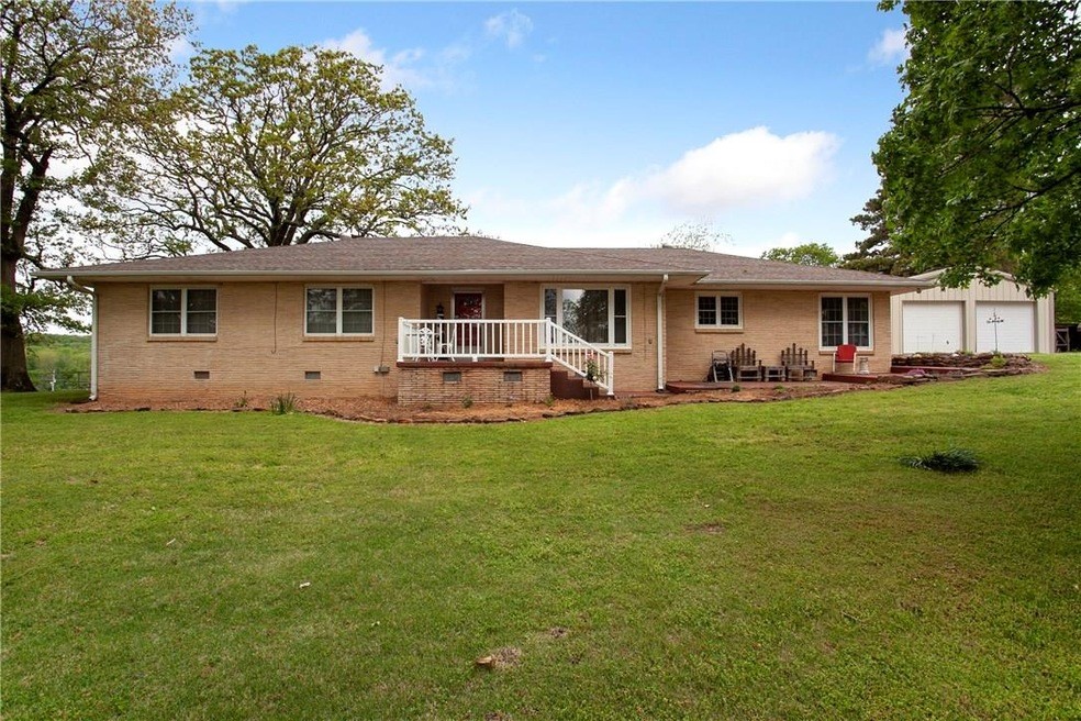 This spacious 2,577 sq ft home offers the perfect blend of comfort, functionality, and outdoor living. With 3 bedrooms and 2 bathrooms, this beautifully maintained property sits on 10 acres and includes a stocked pond (bass, catfish, and perch). Inside, you'll find an updated kitchen with granite countertops, eat-in breakfast area, and formal dining room. Hardwood/engineered hardwood floors and tile run throughout the home. A cedar-lined walk-in closet and a walk-in shower are located in the master bedroom, while the second bath features a convenient tub/shower combo.
Enjoy cozy evenings by the gas fireplace in the living room, and take advantage of abundant built-in storage throughout the home.
This property shines with three shops, one barn, and a shed-perfect for hobbies, storage, or small livestock.
Don't miss your chance to own this rare combination of updated living and country charm — all just a short drive from town!