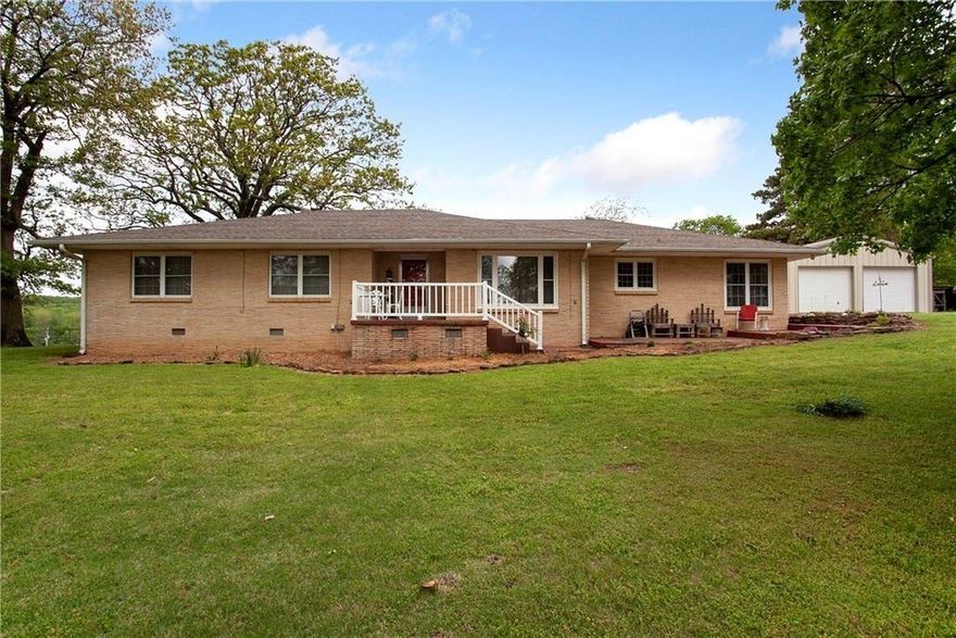 This spacious 2,577 sq ft home offers the perfect blend of comfort, functionality, and outdoor living. With 3 bedrooms and 2 bathrooms, this beautifully maintained property sits on 10 acres and includes a stocked pond (bass, catfish, and perch).  Inside, you'll find an updated kitchen with granite countertops, eat-in breakfast area, and formal dining room. Hardwood/engineered hardwood floors and tile run throughout the home.  A cedar-lined walk-in closet and a walk-in shower are located in the master bedroom, while the second bath features a convenient tub/shower combo.
Enjoy cozy evenings by the gas fireplace in the living room, and take advantage of abundant built-in storage throughout the home.
This property shines with three shops, one barn, and a shed-perfect for hobbies, storage, or small livestock.  
Don't miss your chance to own this rare combination of updated living and country charm — all just a short drive from town!