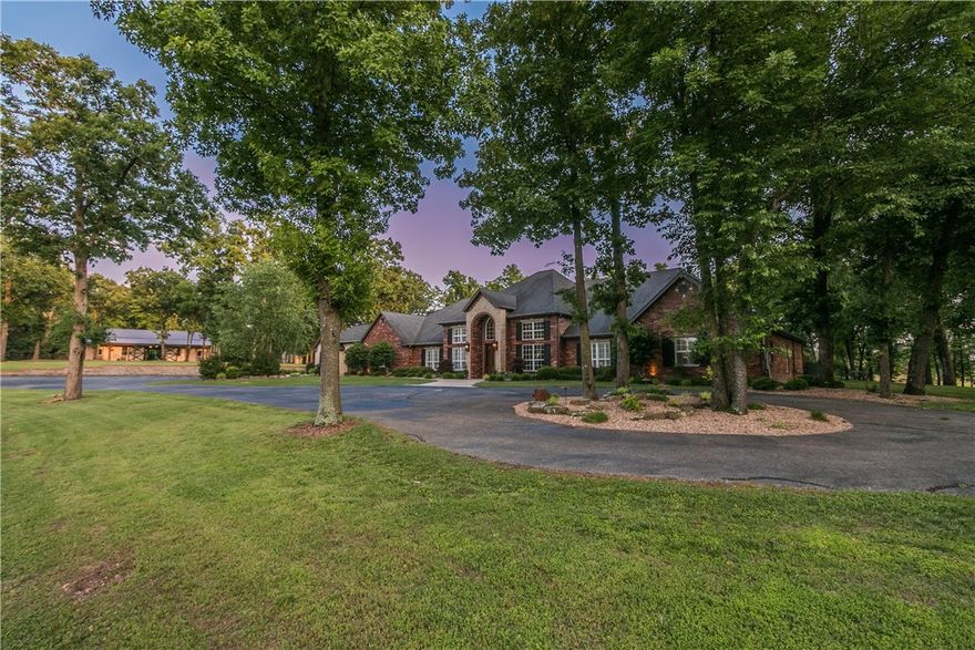 Private 24 acre Bentonville Estate and Builder's personal home located on stunning hilltop setting!  Long winding private driveway leads to the 6800 sfeet estate home on one level, 7BRs, 5.5 Baths.  A True gourmet chef's kitchen like no other!  Featuring Double Islands, SubZero Refrigerator, Wolf Commercial Grade Appliances.   Saltwater pool, Media Room, Exercise Room, Study.  Detached 4 car garage and 60 x 60 horse barn with workshops.    Full spec sheet of whole house amenities and upgrades available upon request.   Shown by Appointment Only.