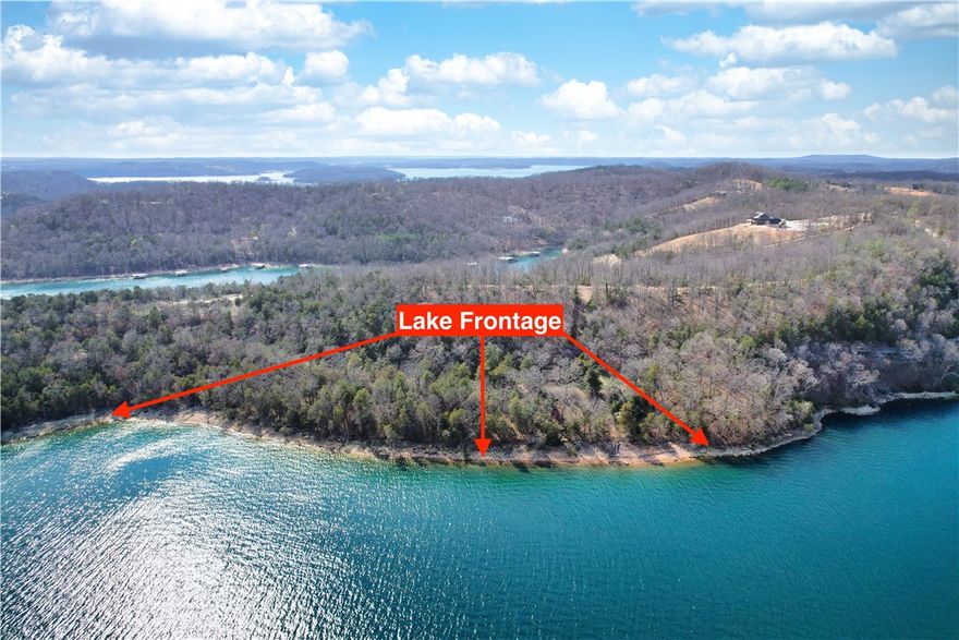 Spectacular 13.07± Acre Lakefront Property on Beaver Lake! Don’t miss this rare opportunity to own a stunning piece of paradise in Northwest Arkansas. Located at the end of Slate Gap Road in Garfield, this expansive property offers approximately 1,000 feet of pristine lake frontage on both sides of the property, providing panoramic views and serene privacy.  The land features multiple potential building sites—ideal for your dream home, a family retreat, or an investment property. A boat dock with a current permit is included, allowing immediate access to one of Arkansas’s most coveted lakes. Tucked behind a locked gate shared with only two other property owners, this secluded setting offers peace, security, and exclusive access. Whether you’re looking to build now or hold as a future investment, this property delivers unmatched value and potential.