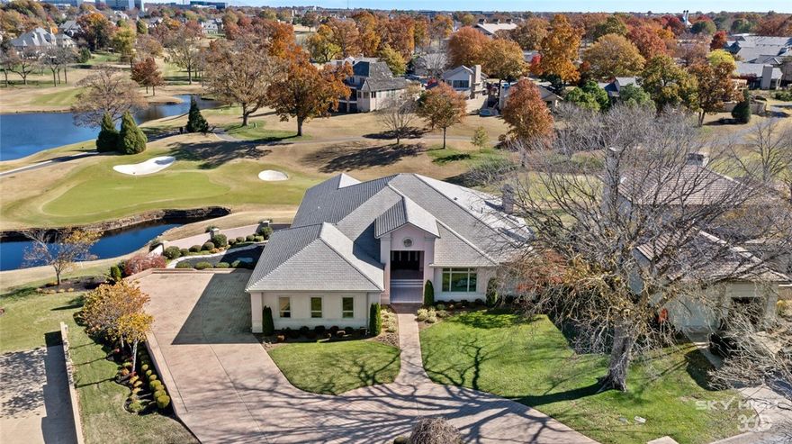 ABSOLUTE BEST views in Pinnacle can be seen from this estate home with 180 degree wrap around views of #2 green and fairway as well as #3 hole, #7 green and #8 tee box down the fairway. Enjoy these picturesque scenes from one of two 900 SF covered decks or relax by the heated saltwater pool with privacy wall. The stunning views from the back wall of floor to ceiling windows are captured as soon as door opens. Soaring ceilings take you to formal living room and formal dining room featuring a crystal chandelier. Family room has bar area for entertaining. Kitchen features lots of counter space, tons of cabinets and a huge pantry all surrounded by two walls of windows that look upon two very peaceful ponds and aforementioned views of the course. Master bedroom is on main level with ensuite featuring dual vanities, make-up area and room sized closet. Downstairs adds office, family room, exercise or media room, guest room and 2nd master both having ensuites and exterior doors allowing access to enjoy the course and pool.