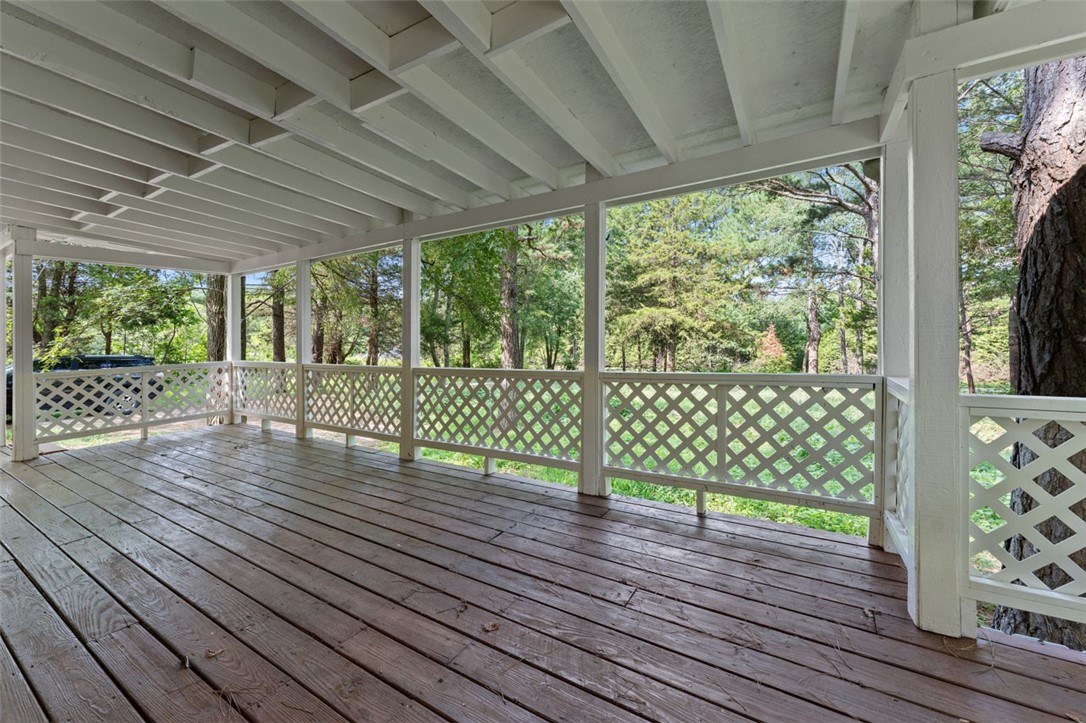 Freshly renovated, this restored home is conveniently located 15 minutes from Rogers and 10 minutes from Lost Bridge Village and boat ramp. The home has 2 bedrooms, 1 master bedroom plus an additional room for an office or playroom. This would make an ideal starter home or investment property. The home is set on 1.2 acres of tranquil countryside, providing a peaceful escape from the hustle and bustle of the city while relaxing on the stunning oversized deck. It is fully equipped with a refrigerator, microwave, electric stove, washer and dryer and is move-in ready . Don't miss your chance to own this amazing country oasis. Property lines in drone photographs are approximate. Sold as is.
