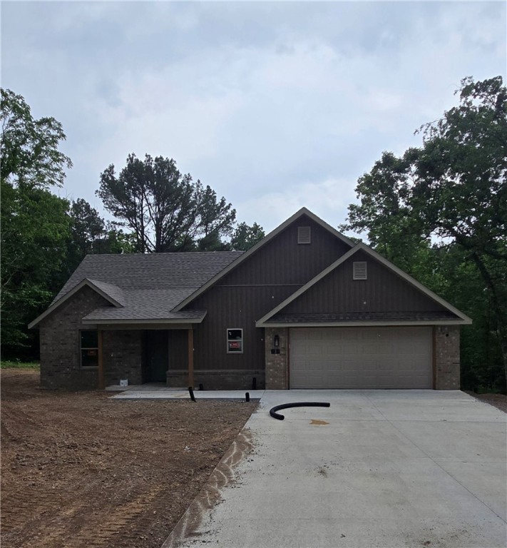 New construction home located in the heart of Bella Vista! This residence features two bedrooms, a bonus room, and two bathrooms. It boasts a spacious open-concept kitchen/dining area, and a living room with vaulted ceilings. Additionally, there is a large walk-in pantry with shelving, spacious laundry room, a two-car garage and a covered back deck with a peaceful view. Amenities include LVP, carpet and tile flooring, 3cm countertops, LED lighting, Frigidaire stainless steel appliance package, full aluminum gutters and more! The location is ideal in the Highlands area, close to Scotsdale Golf Club, Lake Loch Lomond, Little Sugar Trails Trailhead, and more!