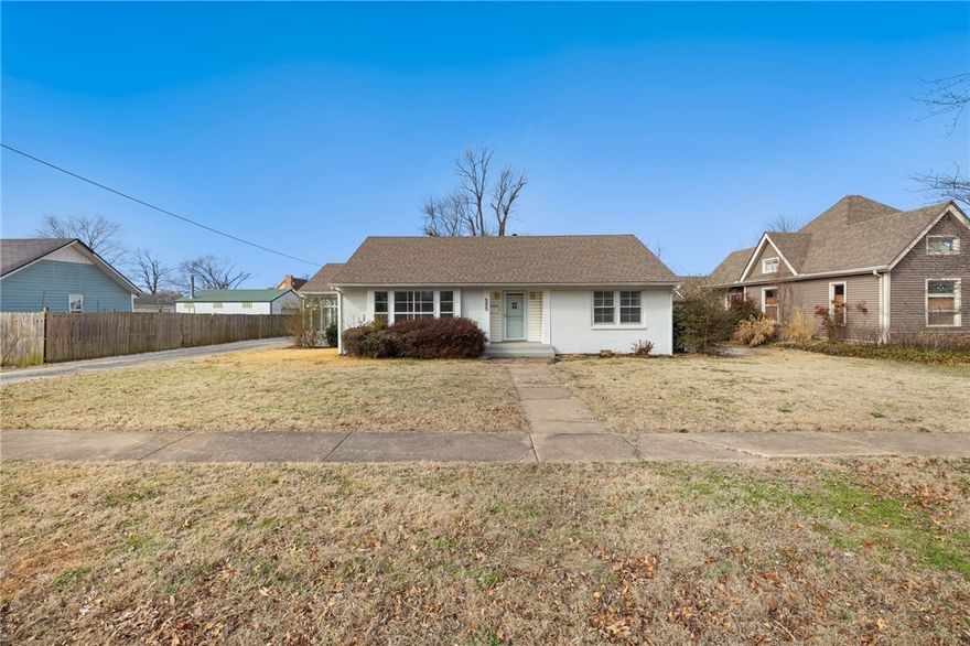This property is located in the heart of downtown Bentonville. It offers easy access to bike trails, renowned museums, and quality schools. 
The cottage-style home has hardwood floors, ample natural light, and a detached garage. With alley access and DN-2 zoning, the property has development potential or would be a great site for a custom home.