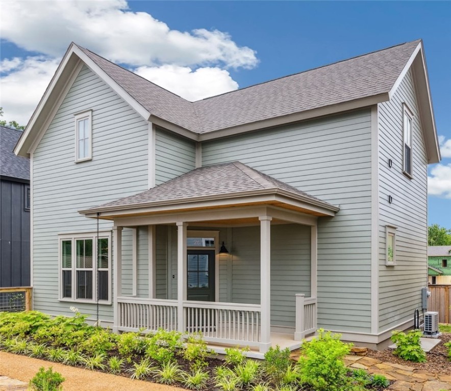 Welcome to the 11th Street Cottages; a new community centered around expertly designed private gardens. Two blocks east of Walker Park and the Greenway Trail, the Cottages are walkable and bikeable to the most sought-after restaurants, shops, neighborhood parks, and art centers in downtown Fayetteville. This floor plan has a spacious living room and open-concept kitchen with generous prep space and bar stool seating at the island. Designed with primary suites and laundry room connections both upstairs and downstairs, the large rooms are complimented by generous walk-in closets and spacious baths. Finished with high-end cabinetry, fixtures, lighting, and ENERGY STAR(r) high performance certified systems for maximum efficiency, comfort & healthy indoor air quality. Enjoy your own private courtyard, or join friends and neighbors on the front porch overlooking the community garden. Each unit also has dedicated parking. Inquire about rent to own options.