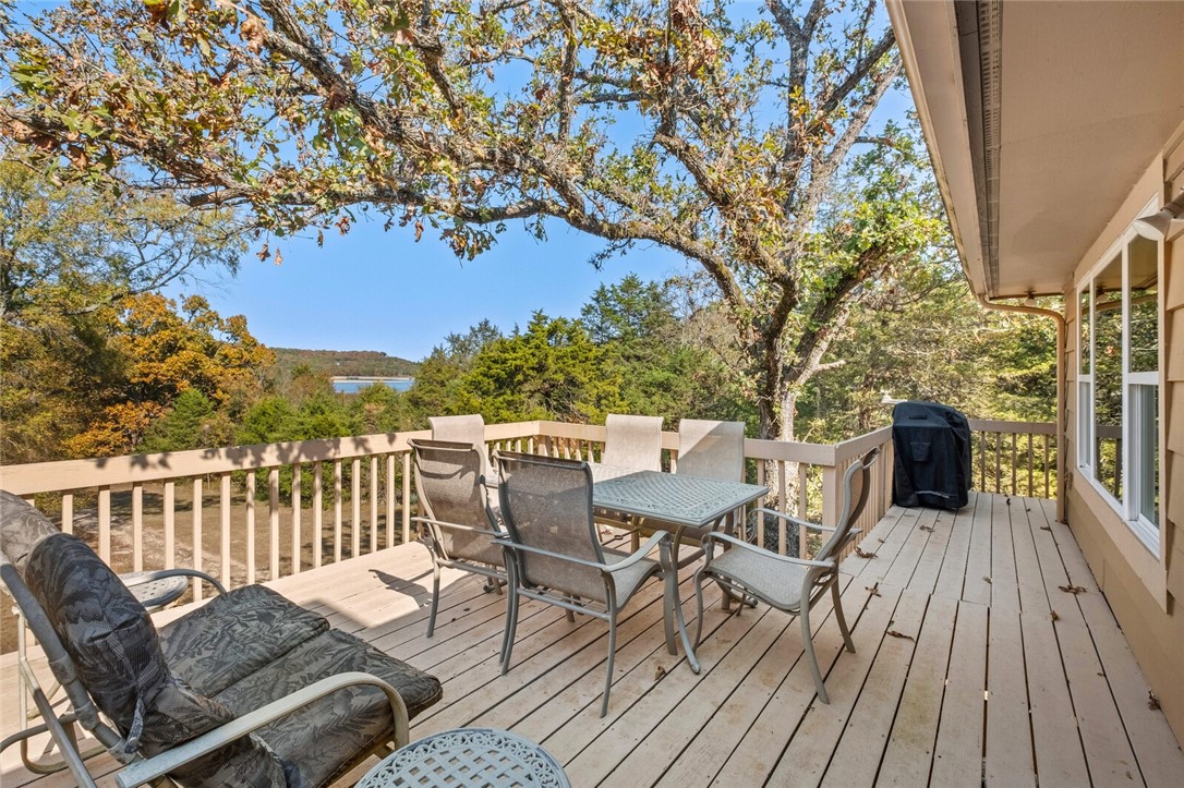 Recently remodeled lake front home with stunning year-round lake views of Beaver Lake! There's direct access to a private 2 slip (10x26 slips) dock, with swim deck. The convenient one-level living, including a semi-open floor plan, wood burning fireplace. This 7.80 acre site carries a lifestyle that encumbers so many options all in one place...your hardest choice would be deciding what to do first! Entertainment, fishing, water sports, or just peace and quiet! Four bedrooms,(which includes a bunk room that sleeps 12, with attached full bath) three full bathrooms, two decks, attached 1+ car garage,(that could be a 2 car) 1296 sq. ft. metal storage building for 2 more cars, boats and toys! A gentle slope road leading to the dock. Enchanting countryside views in any direction you look.
Adding to its appeal, is the additional 4.15 acre lot, ideal for a guest home, making it perfect for multi-generational family members.
Don't miss the opportunity to own this unique and versatile property. Schedule your showing today!