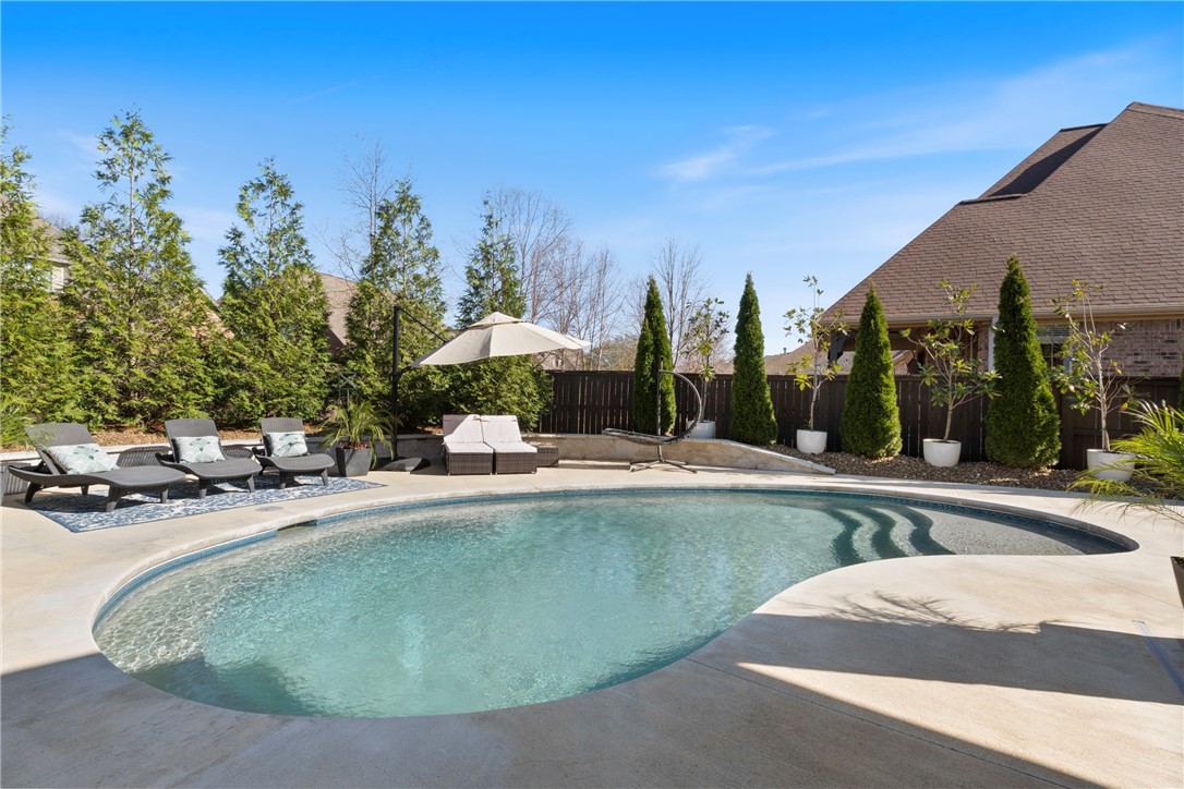 Back on the market at no fault to the seller.
Poolside Oasis!
Unwind in your own private retreat after a long day. This stunning 4-bedroom, 3 full-bath, 2 half-bath home is perfectly situated in one of Bentonville’s most desirable locations — just 5-10 minutes to Downtown Bentonville or SW Rogers.
Built by Payne Construction, this home features a chef’s kitchen complete with a Wolf 6-burner gas cooktop, seamlessly flowing into a bright, spacious living room with soaring ceilings and an abundance of natural light.
Each bedroom offers generous space and walk-in closets, while the media room is perfect for family movie nights, complete with your favorite snacks and cozy vibes.
Located within walking or biking distance to some of the area’s top-rated, highly sought-after schools, this home truly checks every box.
Don’t miss your chance to own this beautiful, well-appointed home and create lasting memories!