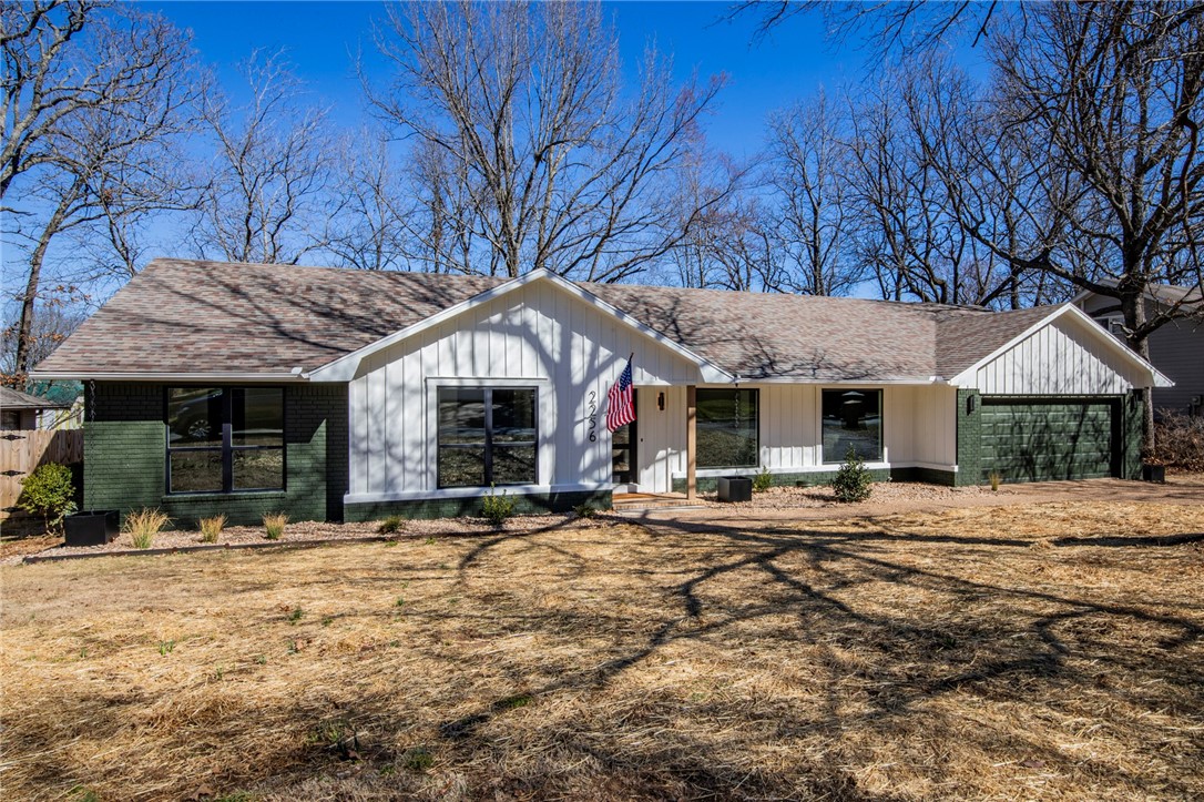 Come see this Fayetteville gem in the idyllic East Oaks neighborhood! This full renovation by Nall Custom Homes and ReJennaRation, LLC is in the heart of it all - central to downtown, uptown, the flyover to I-49 and walking distance to Gulley Park! The house has a simple, open floor plan with vaulted living room ceilings, plenty of room to entertain and a cozy wood-burning fireplace. Major updates include all new low-E windows and doors, Core-tec pro luxury vinyl plank floors, Delta plumbing fixtures, gutters and rain chains, new landscaping w river rocks and drainage, new electrical outlets and switches. In addition, all new Masonite doors and trim, 3 cm quartz counters and backsplash, designer lighting, new hardware, tiled showers, frameless glass enclosure, white oak beams, covered red wood deck, fluted ceramic fireplace and hood vent surround, Fabuwood stained cabinetry w/ maple interiors and soft close. If you've been waiting for an updated home with a great location and plenty of character, this is it!